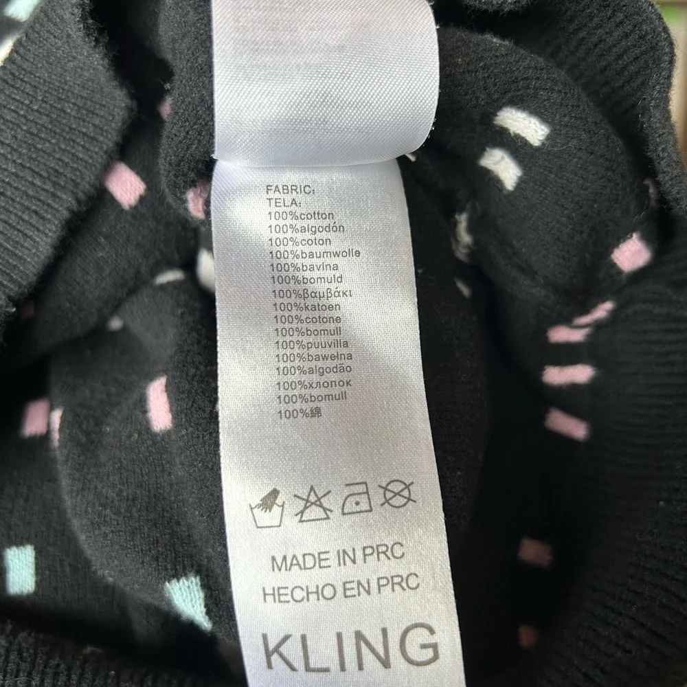 KLING Black, White, and Pastels Crew Neck Long Sleeve Sweater
